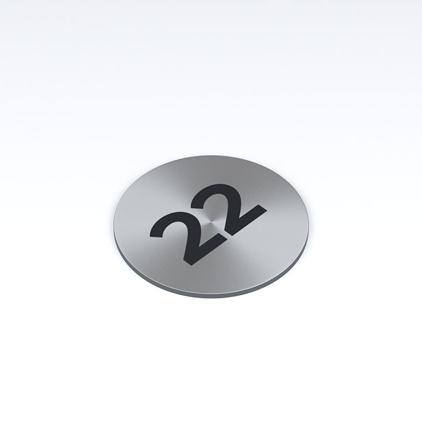 Silver steel circular badge with number twenty two in black